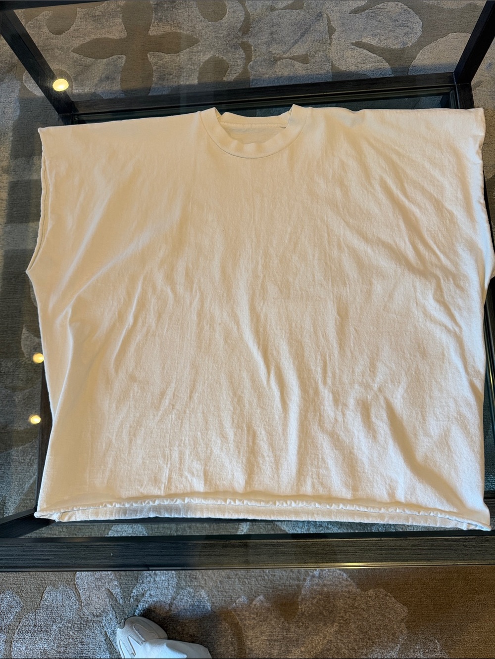 Oversized, thick cotton t-shirt with arms and bottom cut off.